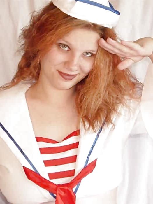 14P Pregnant redhead taking off her sailors uniform