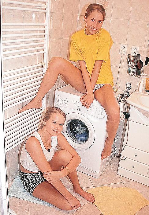23P Anita & Sasha playing with each other in the utility room