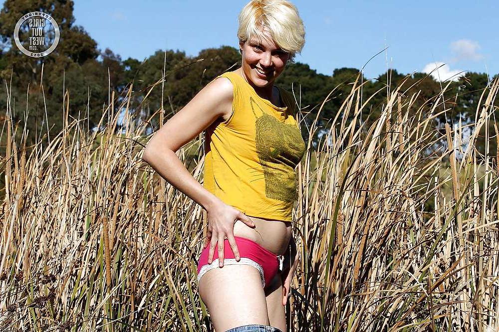 16P Horny blonde toys her hairy cunt outdoors