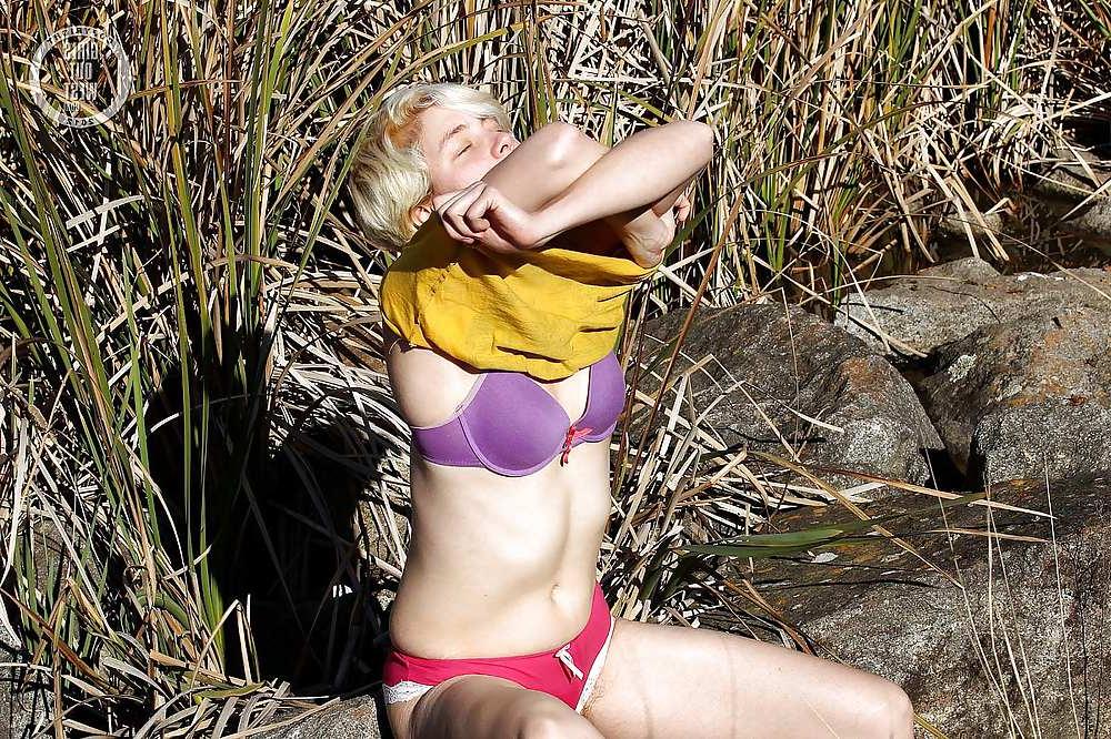16P Horny blonde toys her hairy cunt outdoors