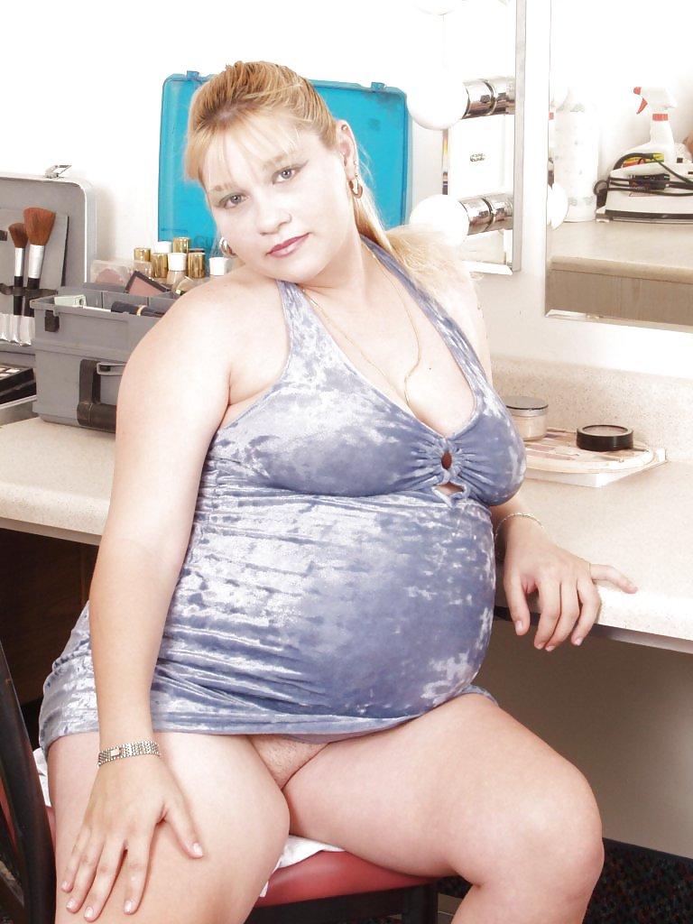 15P Pregnant blonde posing in her dressing room