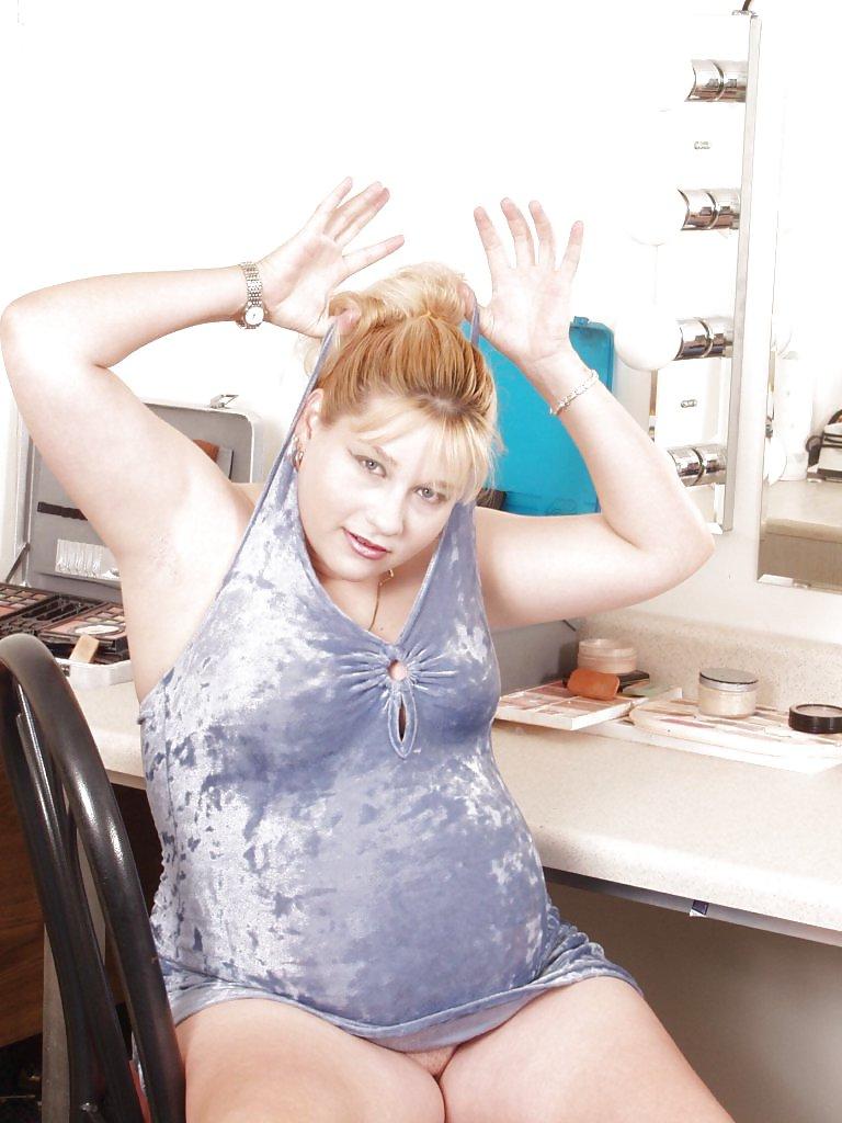 15P Pregnant blonde posing in her dressing room