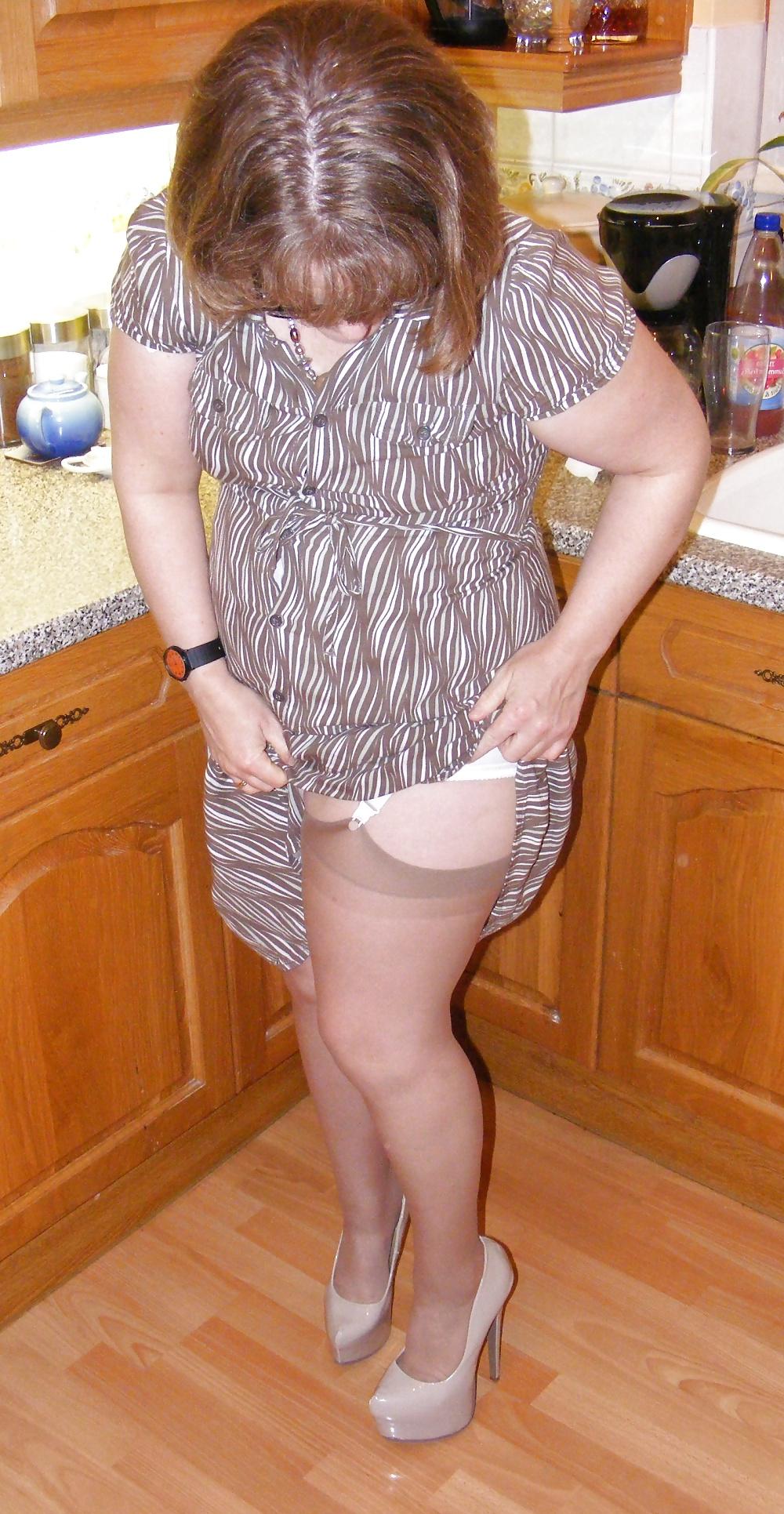 25P Slutty secretary in girdle, stockings and platform heels