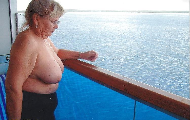 15P Showing her tits to the room service and the passing boaters