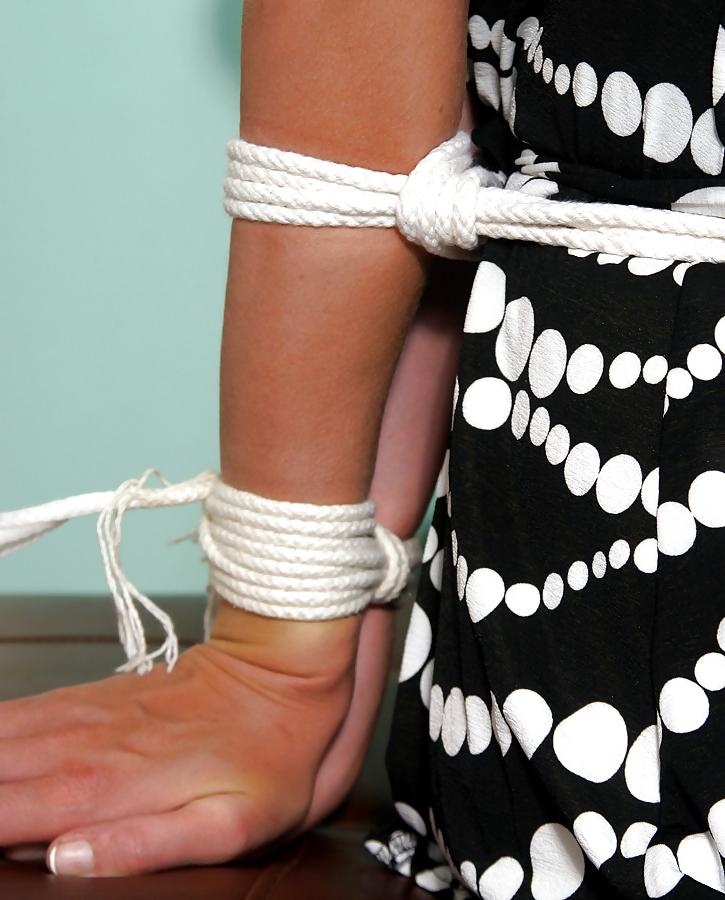 25P Beautiful Curly-haired Blonde Tied Up with Legs Spread