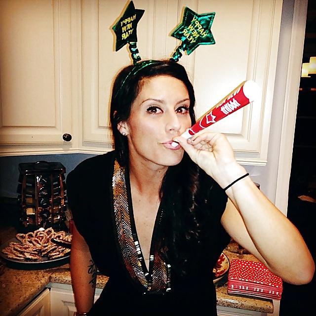 24P Ali Krieger posing in her sports bra