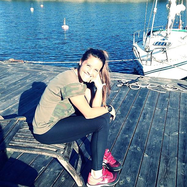 24P Ali Krieger posing in her sports bra