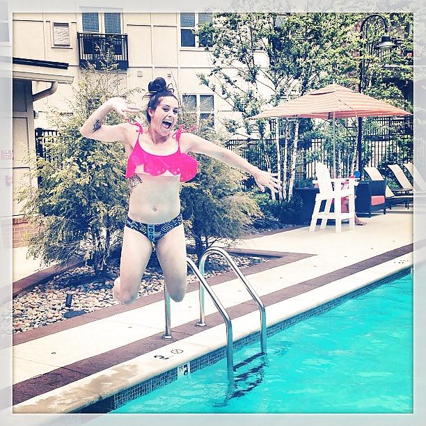 24P Ali Krieger posing in her sports bra