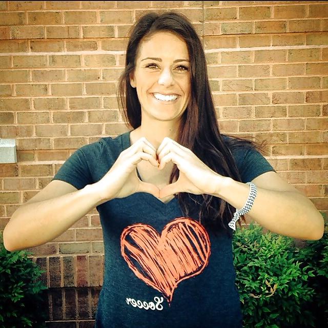 24P Ali Krieger posing in her sports bra