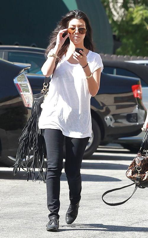 8P Kourtney Kardashian (black bra visible)