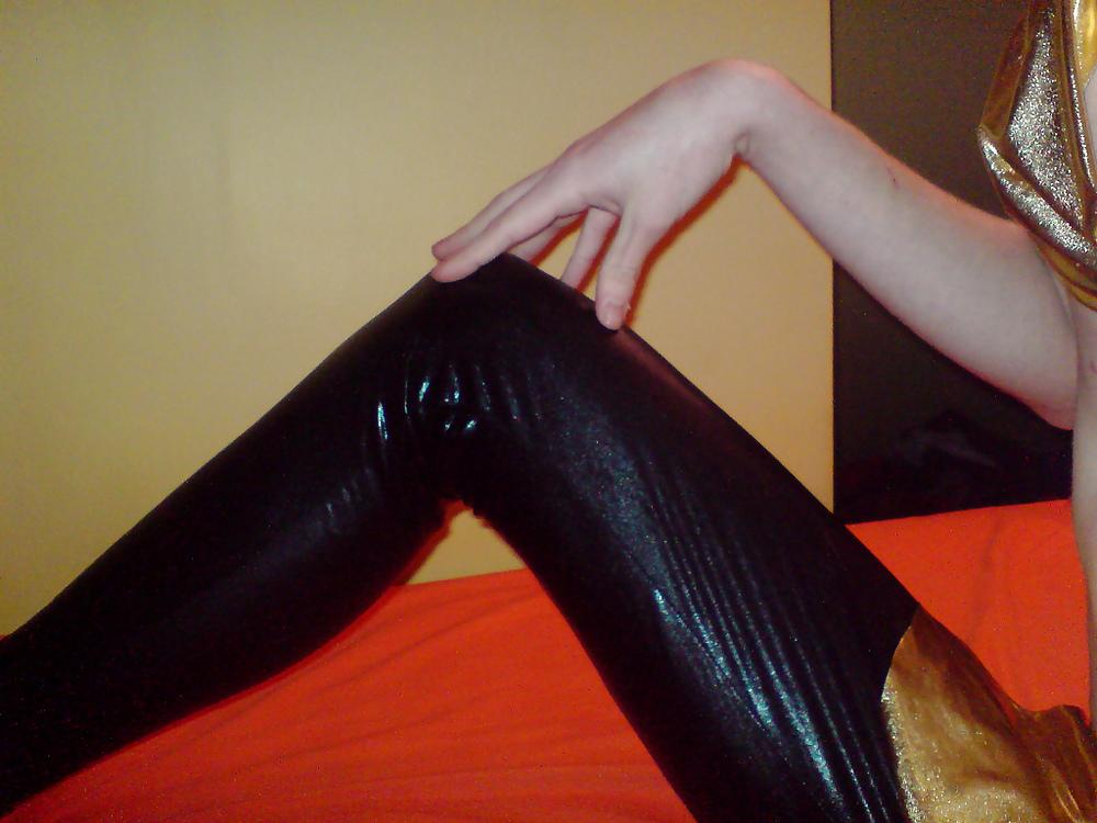 10P Sissy wears a gold mini skirt & bra
