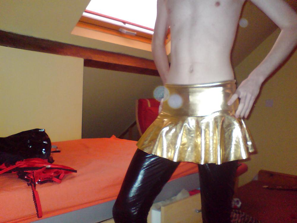 10P Sissy wears a gold mini skirt & bra