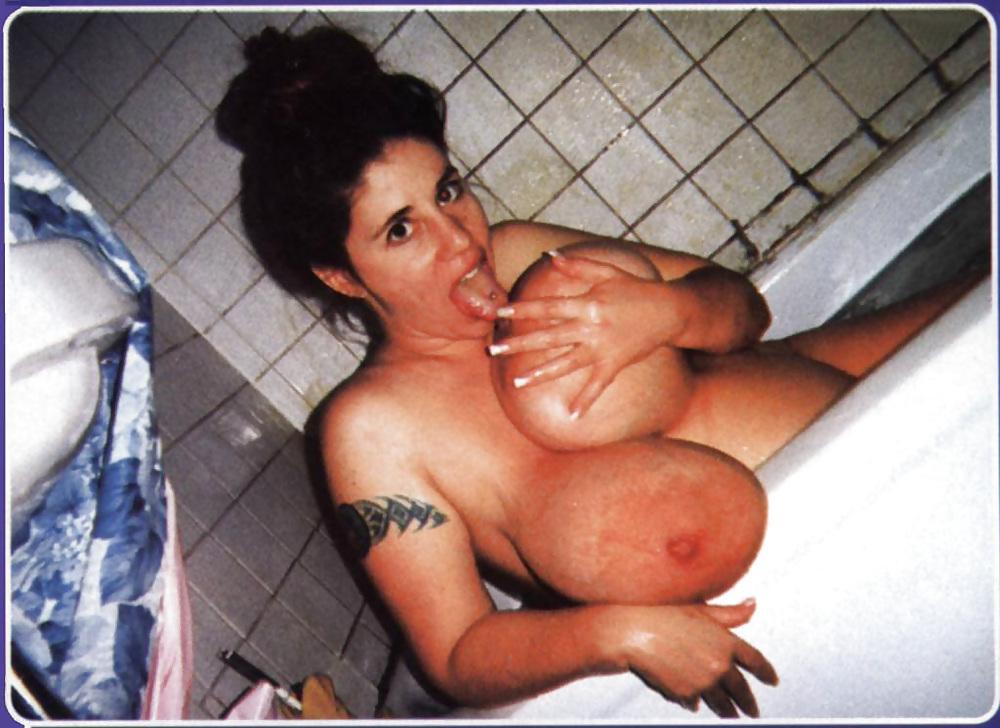 9P Huge-titted pregnant brunette posing in her bath