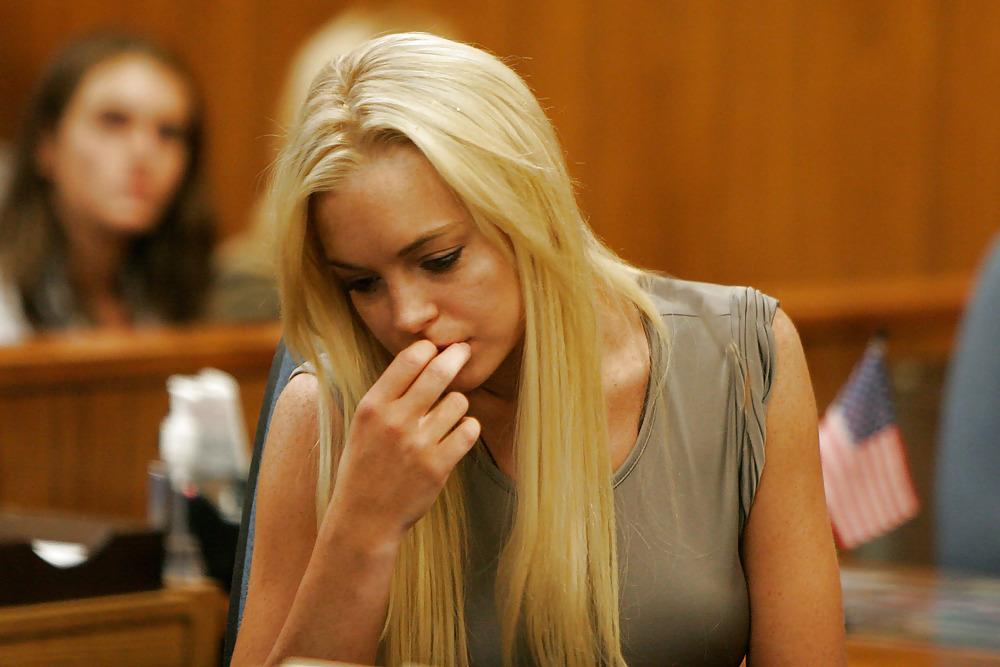 19P Lindsay Lohan caught in see-through top shows a white bra