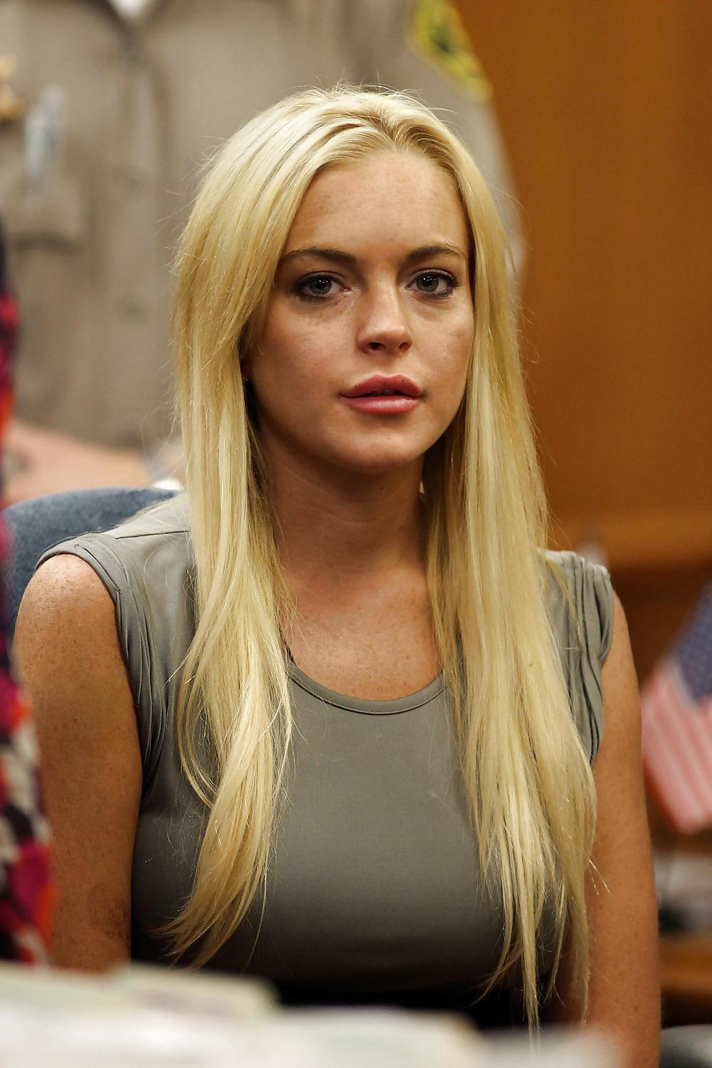 19P Lindsay Lohan caught in see-through top shows a white bra