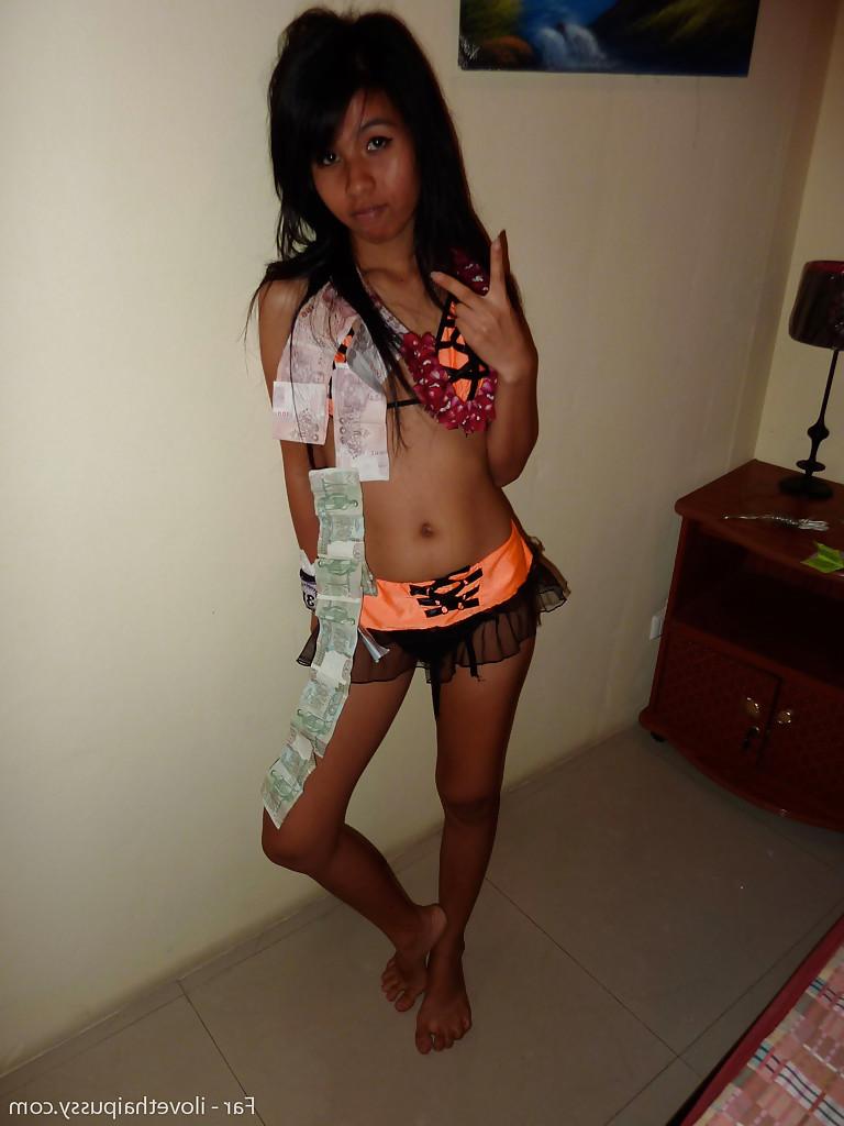 12P Petite Thai bar girl showing off her shaved pussy for money