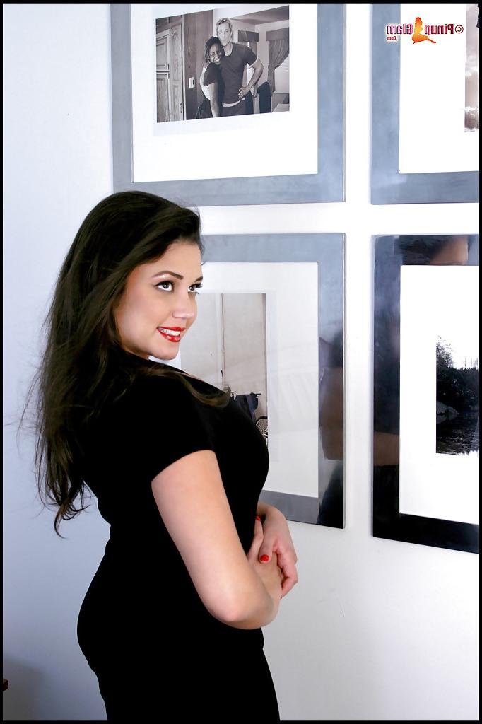 16P Stunning busty babe with a beautiful face poses to show her body