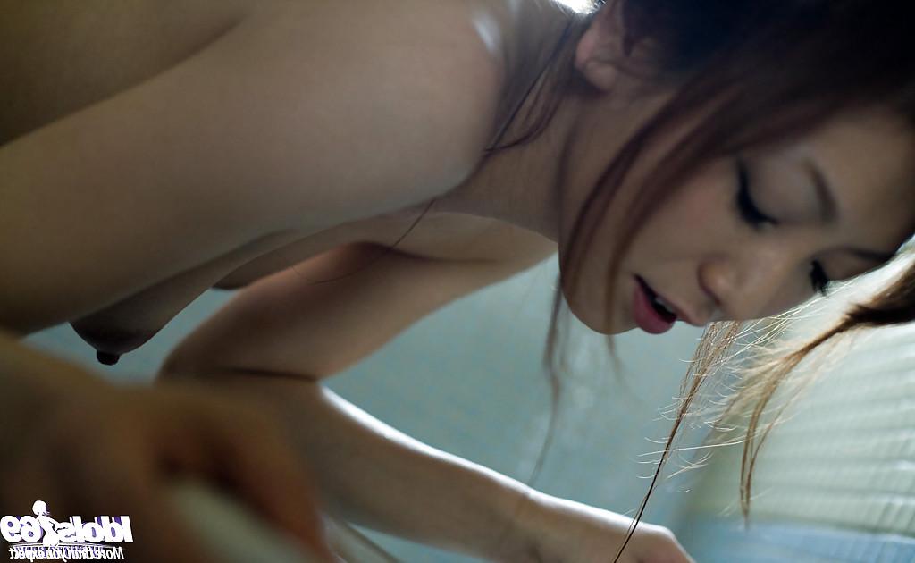 15P Naked asian babe with petite fanny Emi Harukaze taking bath