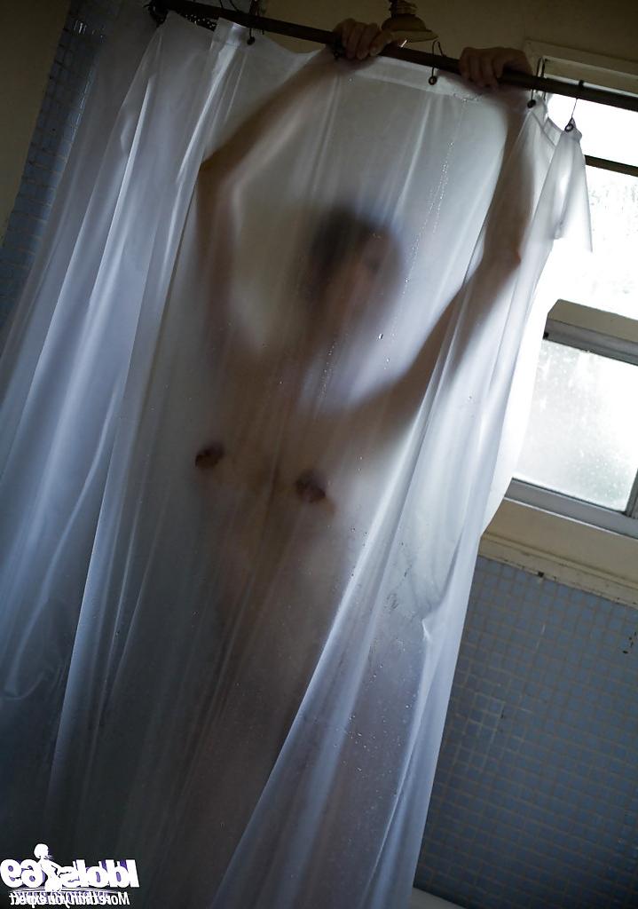 15P Naked asian babe with petite fanny Emi Harukaze taking bath