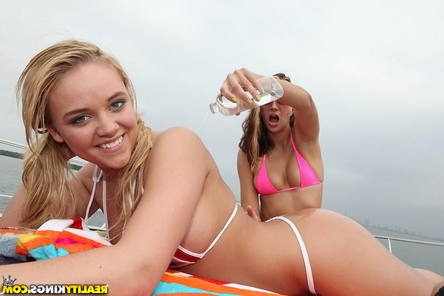 16P Tempting blonde chick in tiny bikini gets oiled up outdoor
