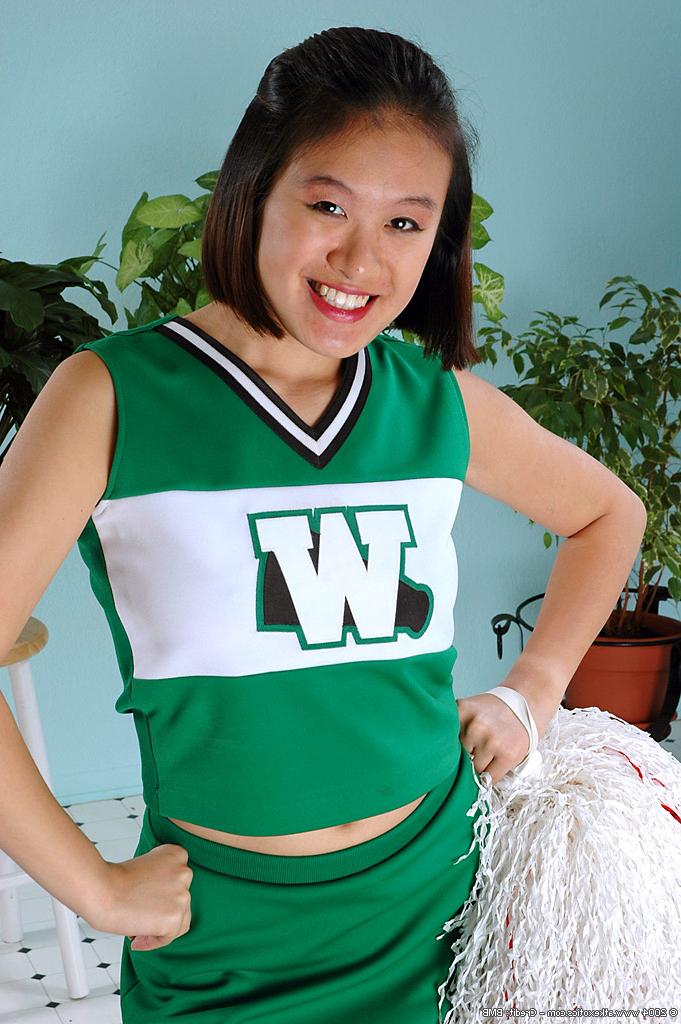 16P Amateur Asian freeing big tits and ass from beneath cheerleader uniform