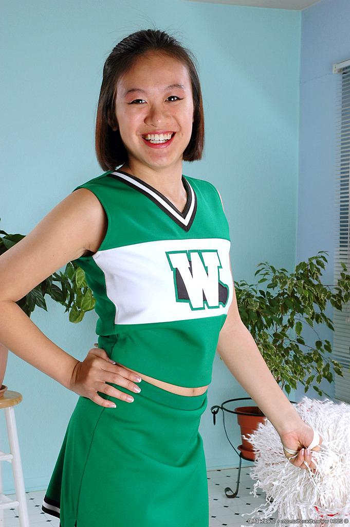 16P Amateur Asian freeing big tits and ass from beneath cheerleader uniform