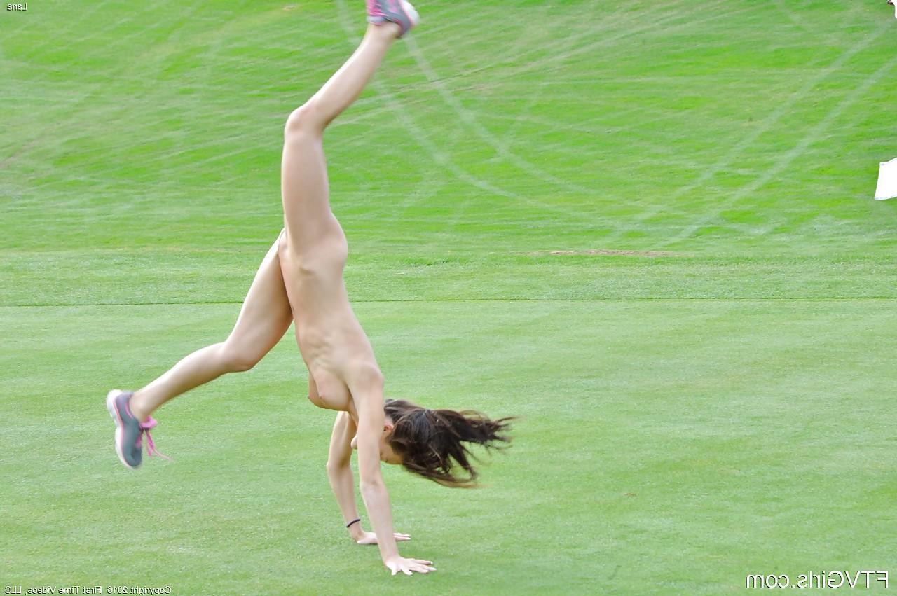 15P Fit chick strips off sports workout clothes to model naked on golf course