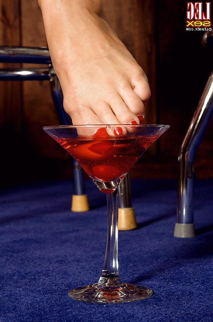 16P Brunette MILF with fake tits Krista Kaslo plays a foot fetish solo at the bar