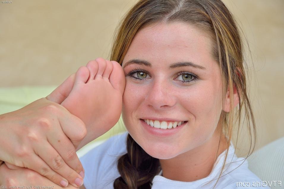 15P Gorgeous young minx likes licking her feet and fingering her wet cunt
