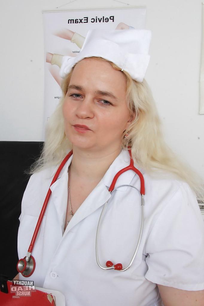 16P Older blonde nurse Elena stripping off nurse's uniform in examination room