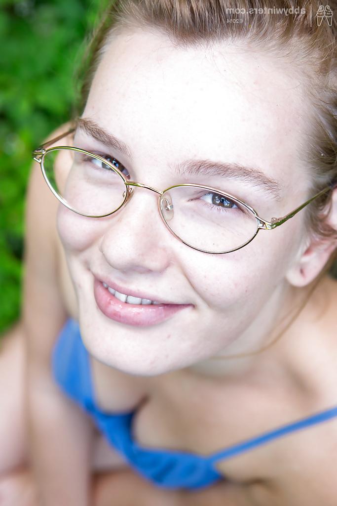 16P Solo girl in glasses strips naked in woods and masturbates hairy cunt