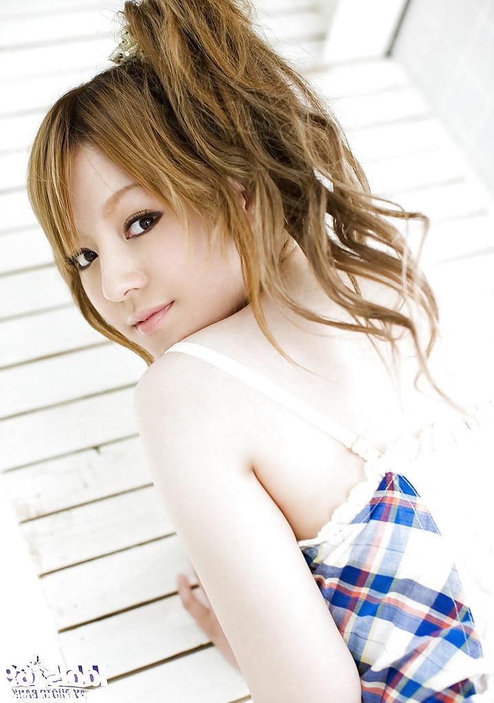 15P Pretty asian babe with tiny tits Ria Sakurai stripping off her dress