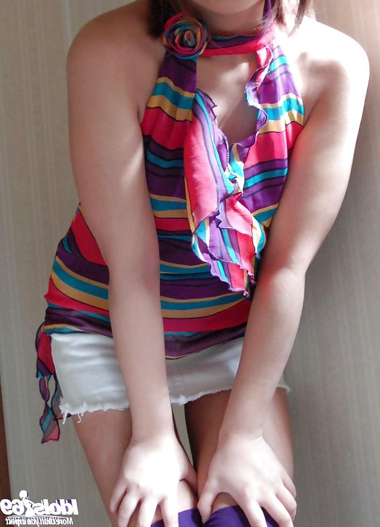 12P Petite asian teen with tempting ass stripping all of her clothes