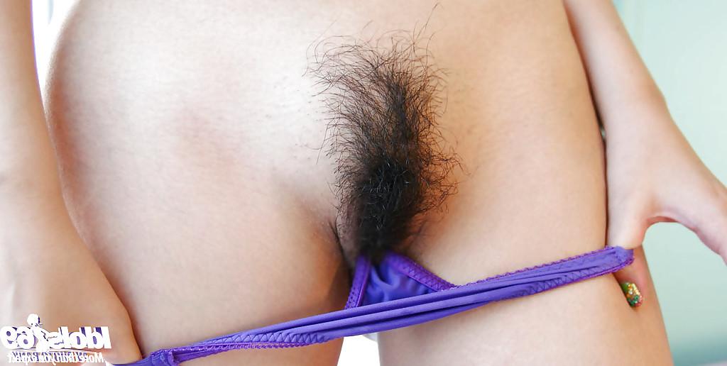 16P Asian babe with tiny tits and hairy cunt slipping off her clothes