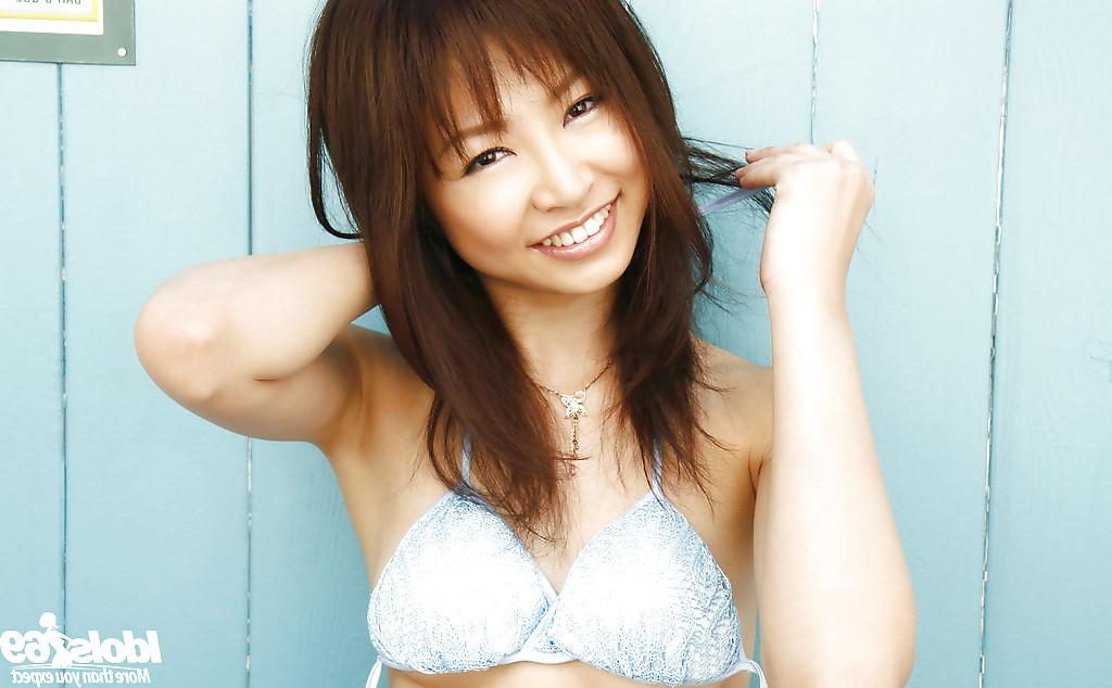 15P Slim asian teen babe Hara Sarasa stripping off her clothes outdoor