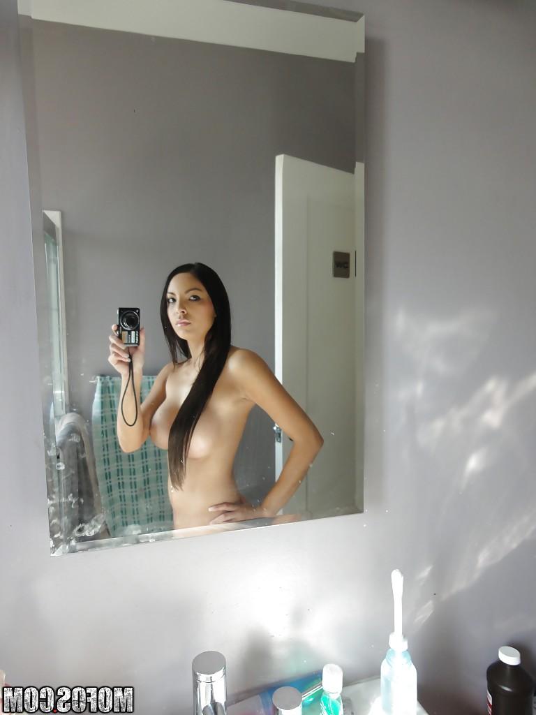 16P Latina brunette Danni Cole dose self shots while naked in the bathroom