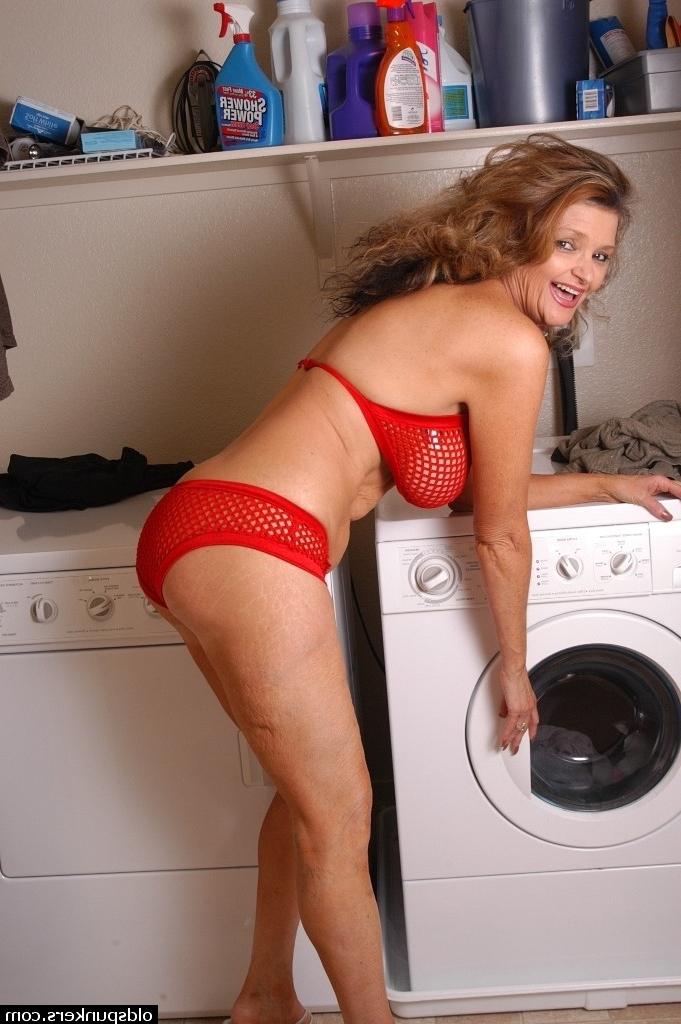 16P Older blonde woman Raven posing seductively in mesh bra and panties