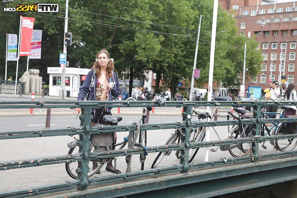 16P Brunette European slut with big tits Nadia Bells posing in public