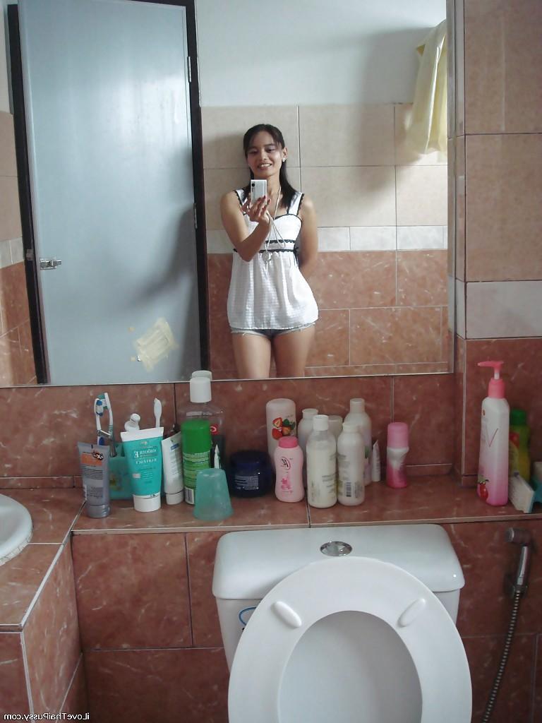 16P Petite Thai girl tales self shots before stripping naked in bathroom