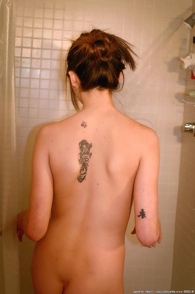16P Amateur Latina babe with tattoos flaunting pierced nipples in shower