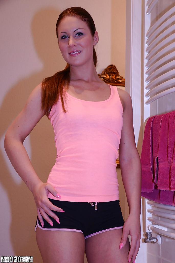 16P Amateur redhead Regina strips off thong panties before taking nude shower
