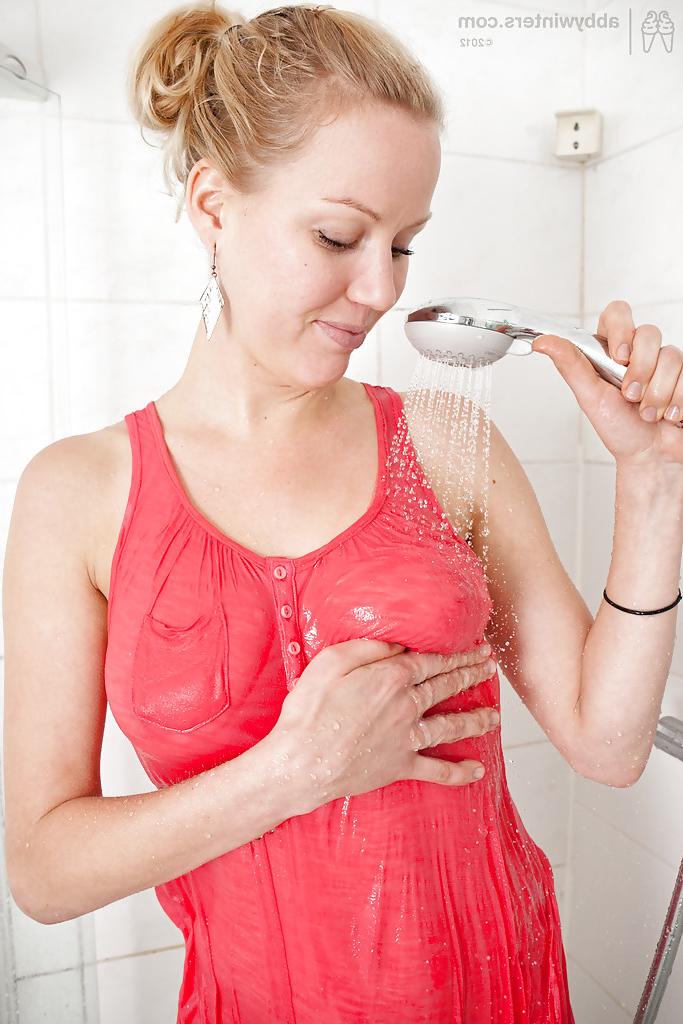 16P Blonde first timer Misha removes denim skirt and panties in shower