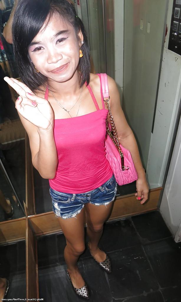 14P Petite Thailand chick with small breasts taking shower and toying pussy
