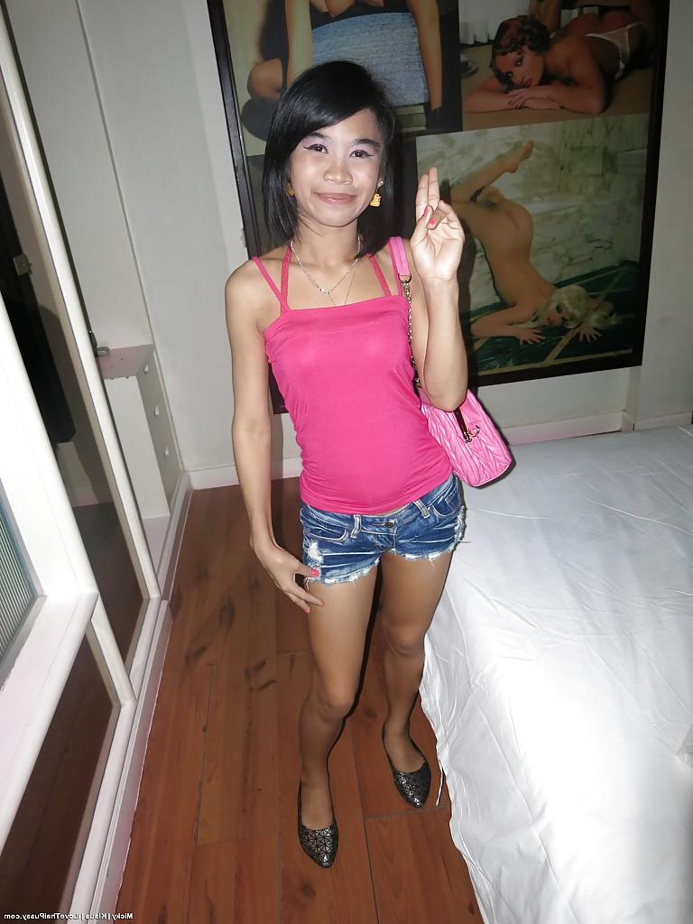 14P Petite Thailand chick with small breasts taking shower and toying pussy
