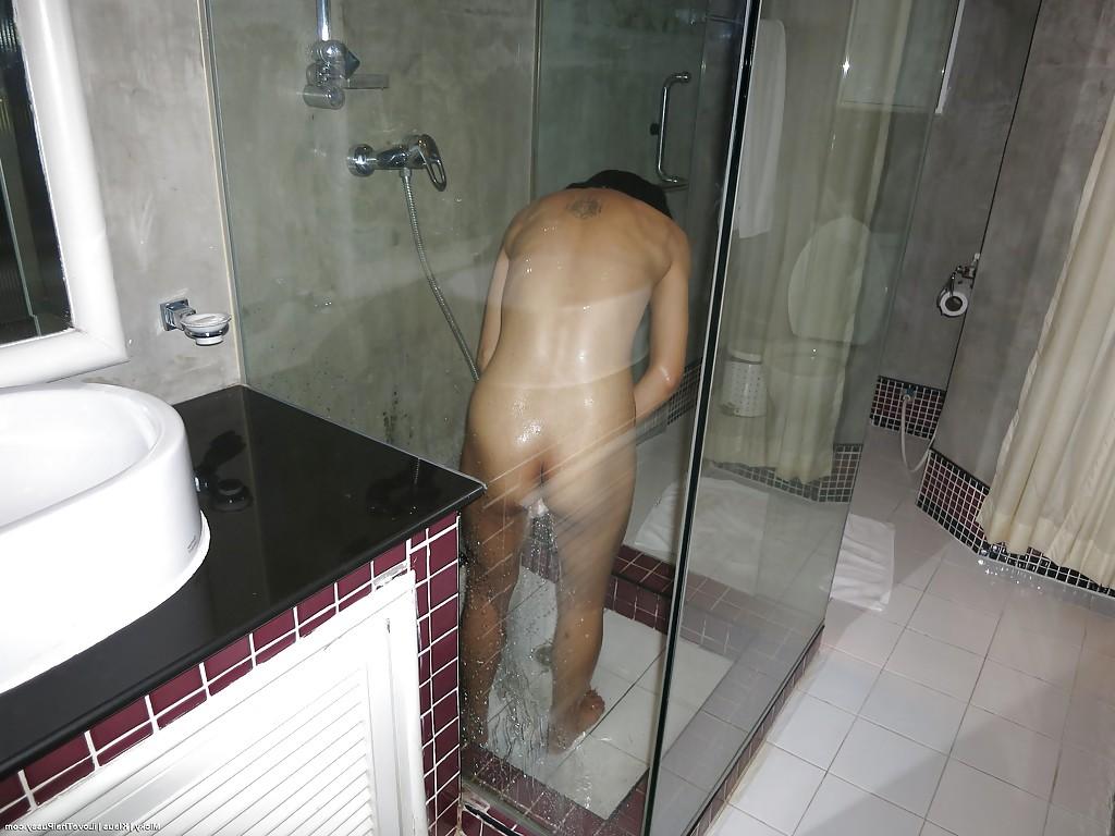 14P Petite Thailand chick with small breasts taking shower and toying pussy