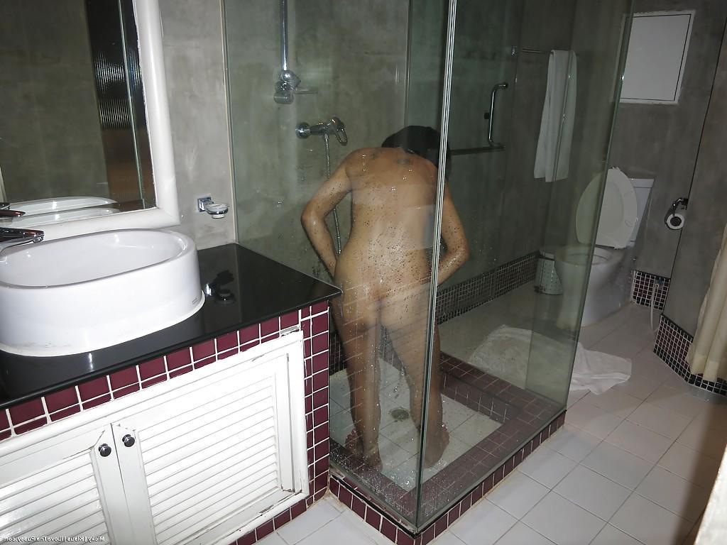 14P Petite Thailand chick with small breasts taking shower and toying pussy