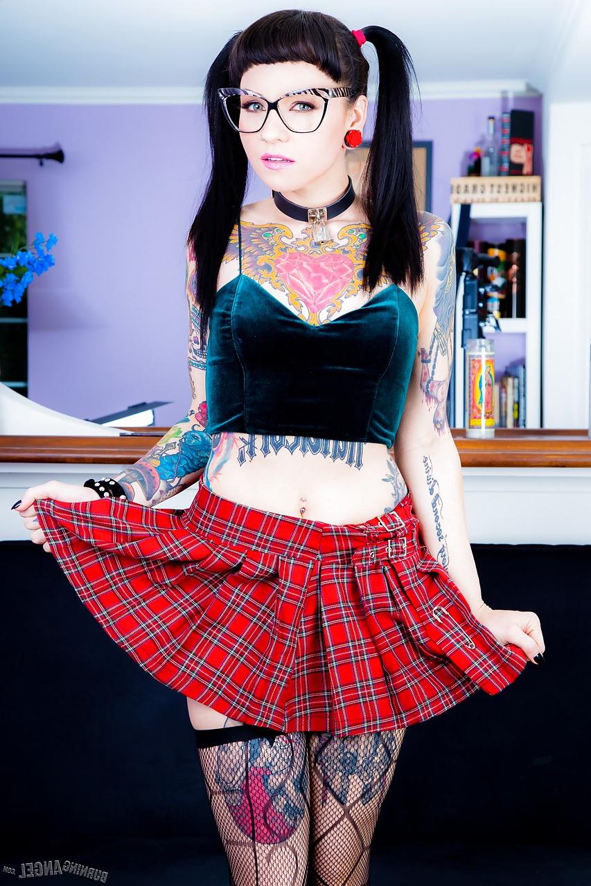 15P Tattooed Necro Nicki in pigtails & short skirt on knees showing tight ass