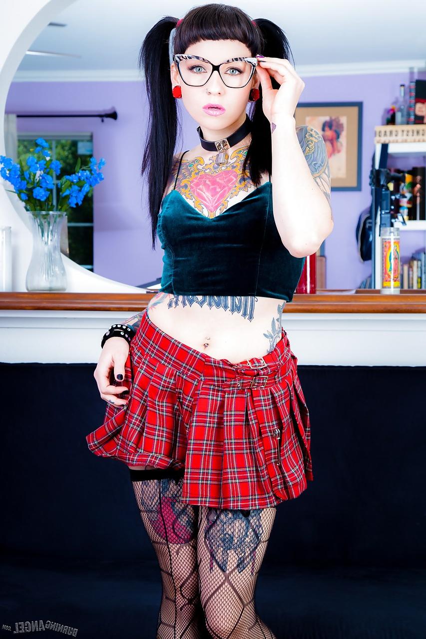 15P Tattooed Necro Nicki in pigtails & short skirt on knees showing tight ass