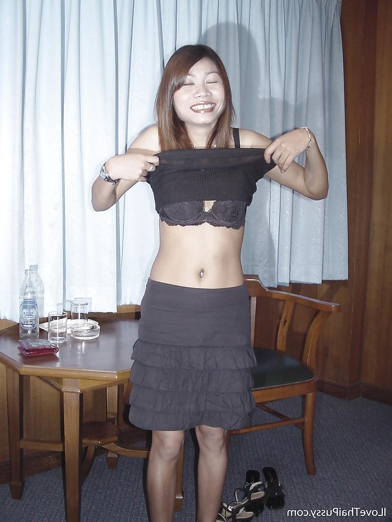 16P Asian cutie stripping and showing off her tiny tits and hairy pussy