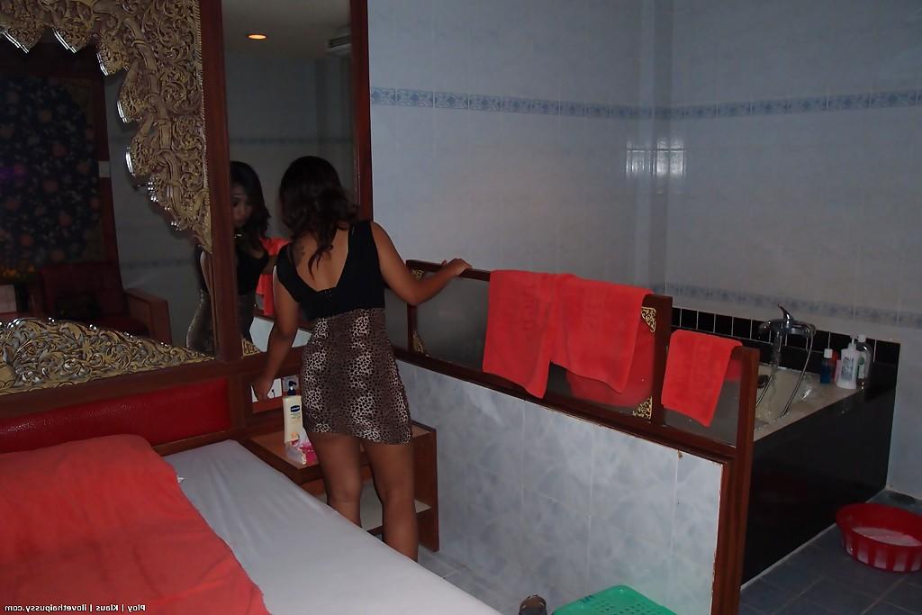 16P Seductive asian babe taking off her clothes and taking bath